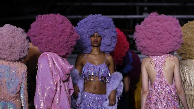 Models present creations at the Ashish catwalk show at London Fashion Week Autumn/Winter 2016 in London