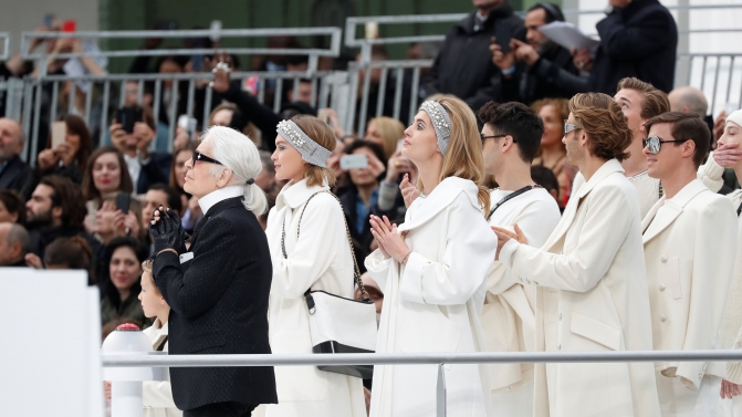 German designer Karl Lagerfeld appears at the end of his Fall/Winter 2017-2018 women’s ready-to-wear collection for fashion house Chanel at the Grand Palais during Fashion Week in Paris
