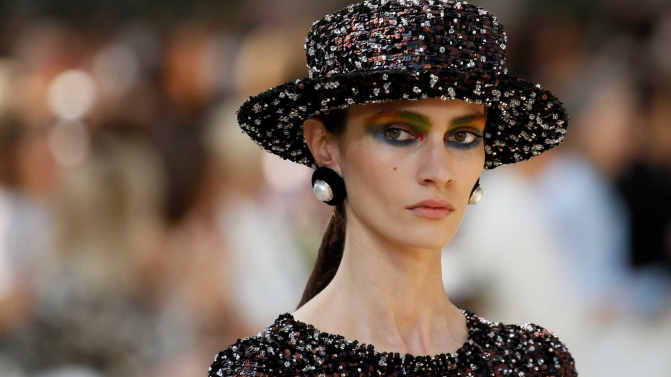 A model presents a creation by German designer Karl Lagerfeld as part of his Haute Couture Fall/Winter 2017/2018 collection for fashion house Chanel in Paris