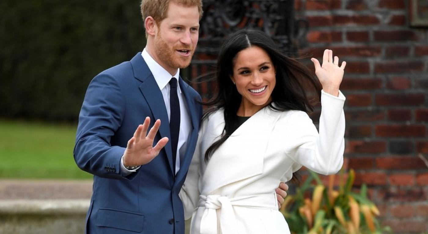 Britain’s Prince Harry poses with Meghan Markle in the Sunken Garden of Kensington Palace, London