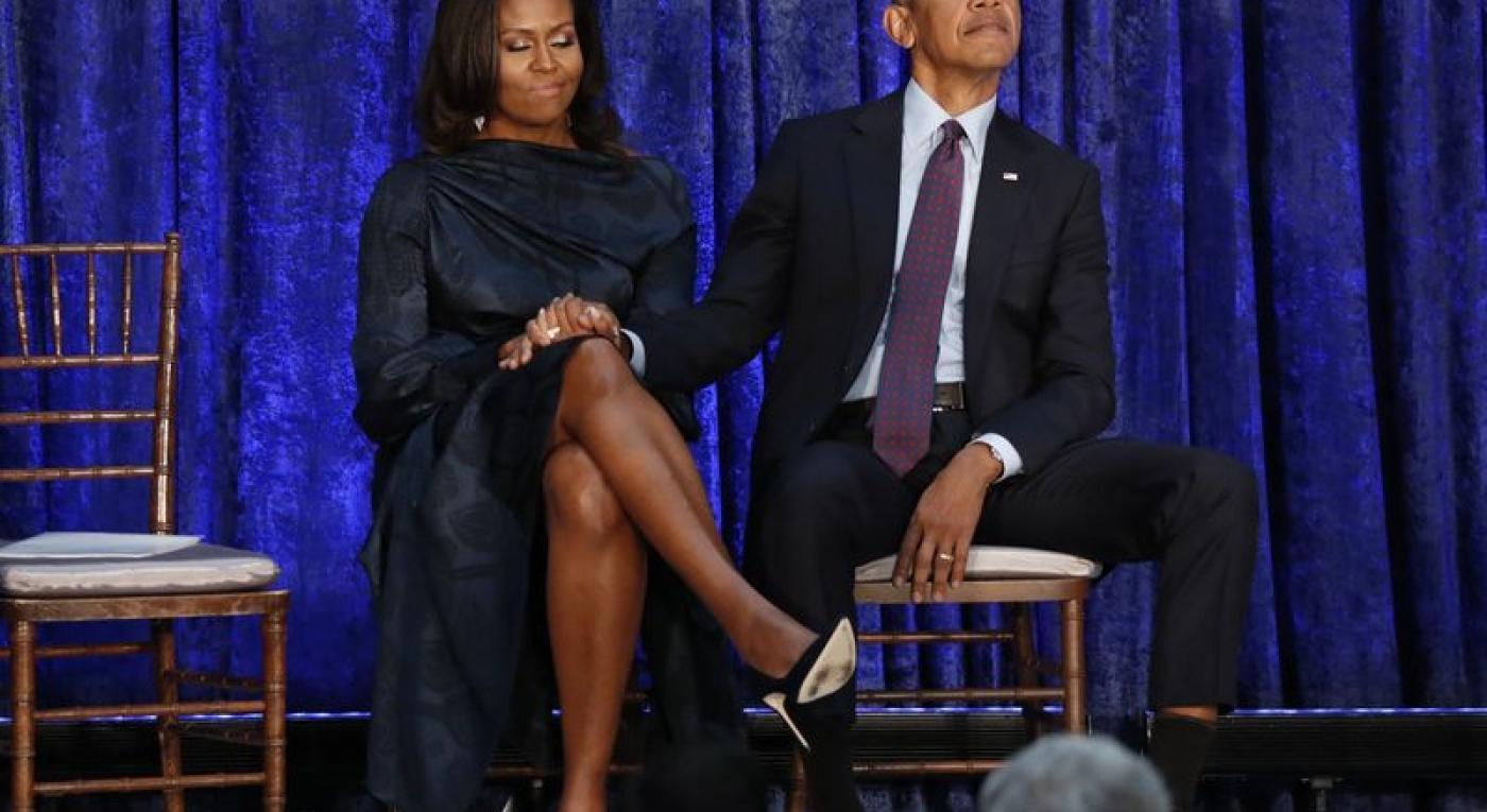Former U.S. President Obama and first lady Michelle Obama hold hands prior to portraits unveiling at the Smithsonians National Portrait Gallery in Washington