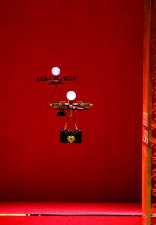Drones carry bags, the creations from the Dolce & Gabbana Autumn/Winter 2018 women’s collection during Milan Fashion Week in Milan