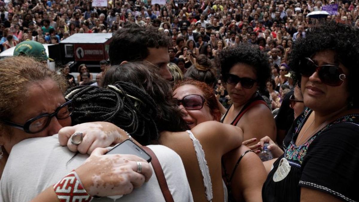 Demonstrators react outside the city council chamber ahead of the wake of Rio de Janeiro’s city councillor Marielle Franco, 38, who was shot dead, in Rio de Janeiro