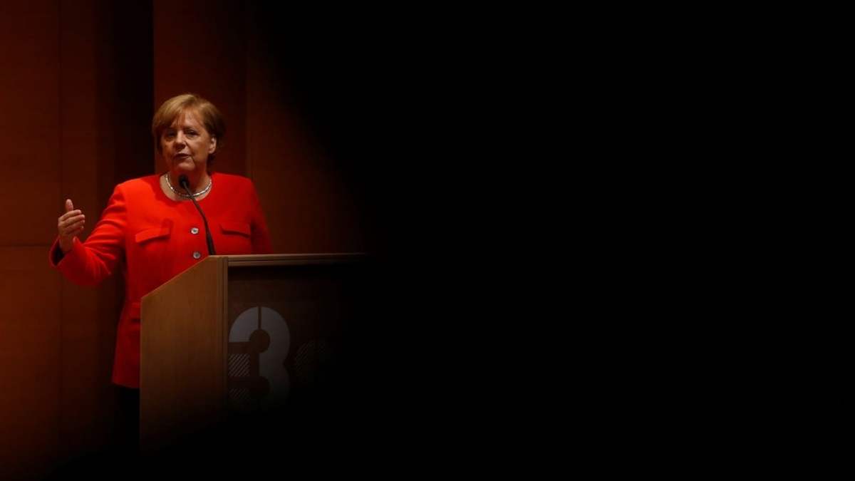 German Chancellor Angela Merkel delivers a speech during her visit to the Institute of Research and Innovation in Health in Porto