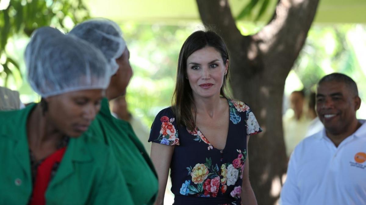 Spain’s Queen Letizia speaks with women during a visit to an organic banana cooperative in Azua