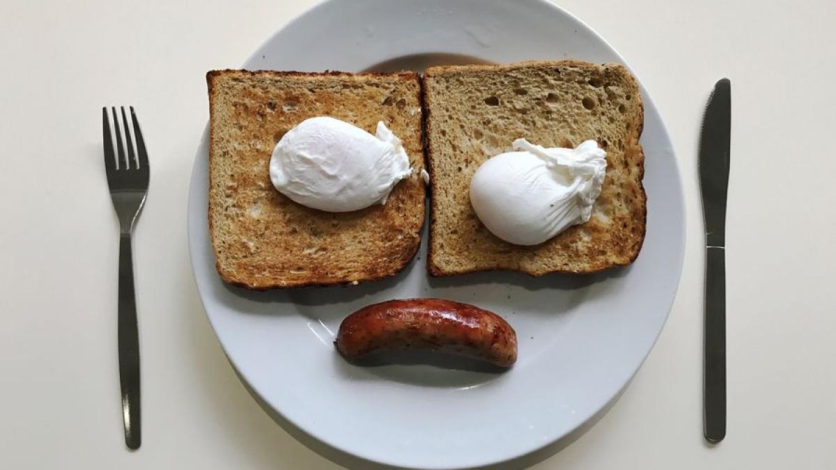 A breakfast of sausage, eggs and toast is pictured in an office canteen in London