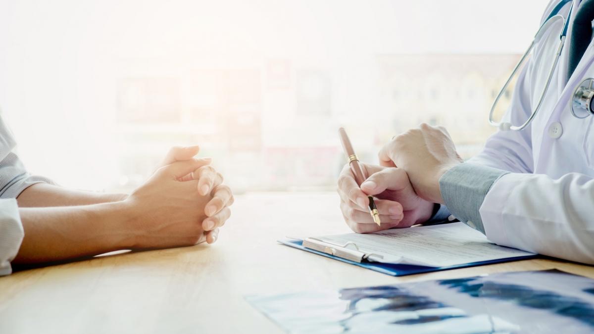 Doctors and patients sit and talk. At the table near the window in the hospital.
Doctors and patients sit and talk. At the table near the window in the hospital.