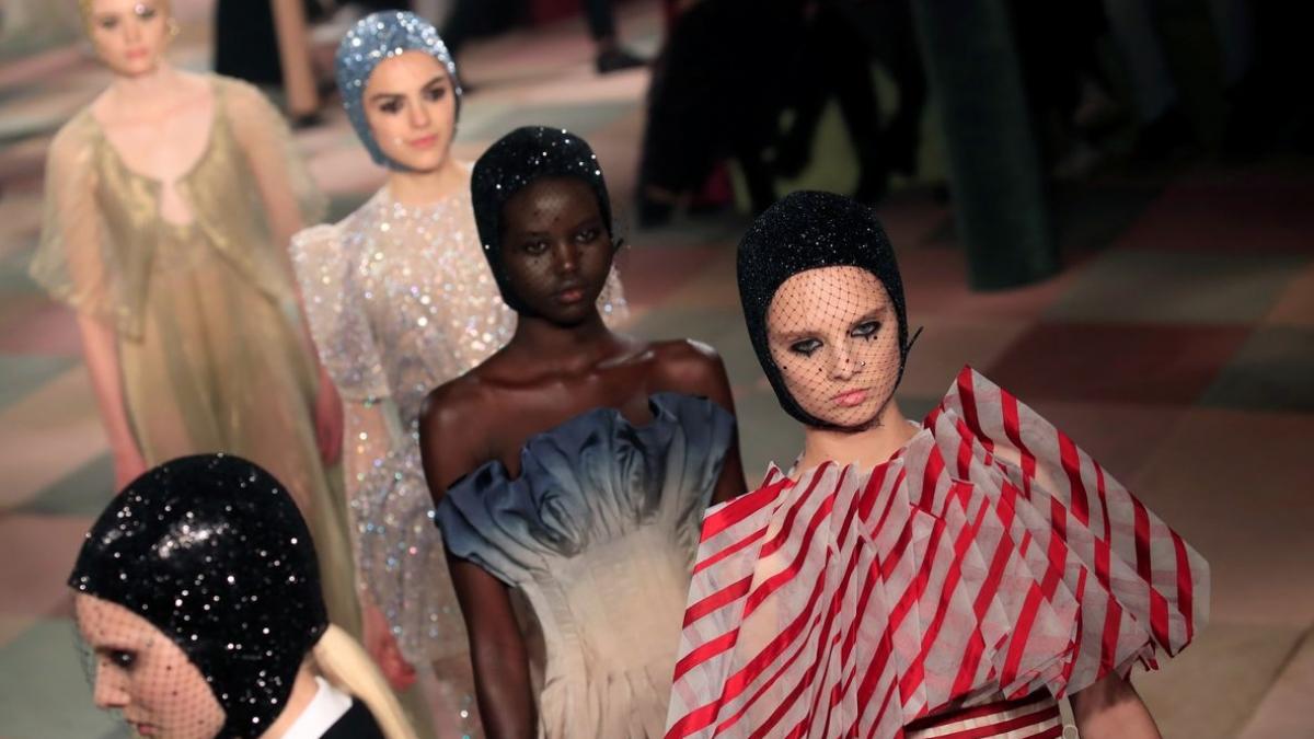 Models present creations by designer Maria Grazia Chiuri as part of her Haute Couture Spring-Summer 2019 collection show for fashion house Dior in Paris