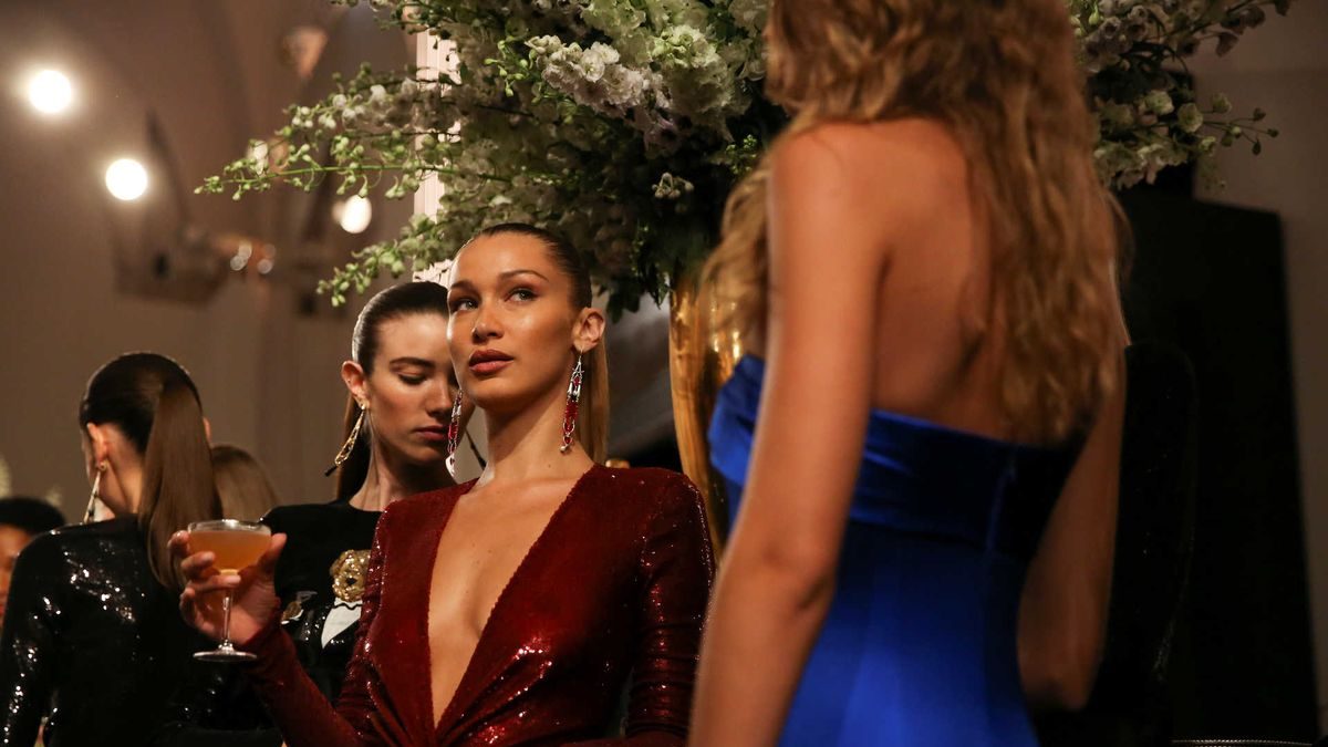 Models relax after presenting creations from the Ralph Lauren collection during New York Fashion Week