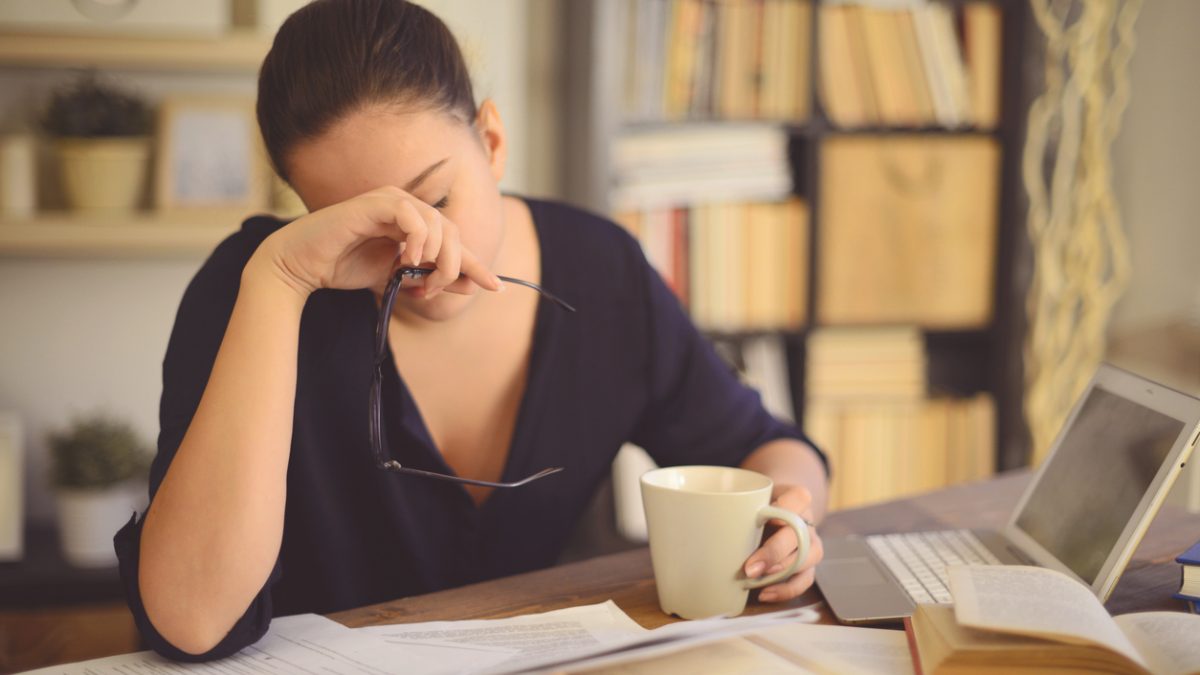 young woman working at home( headache)