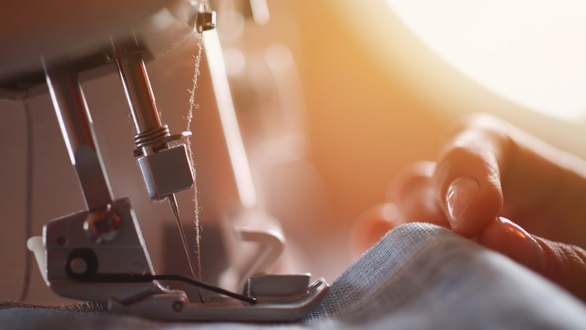 Tailor at work on sewing machine