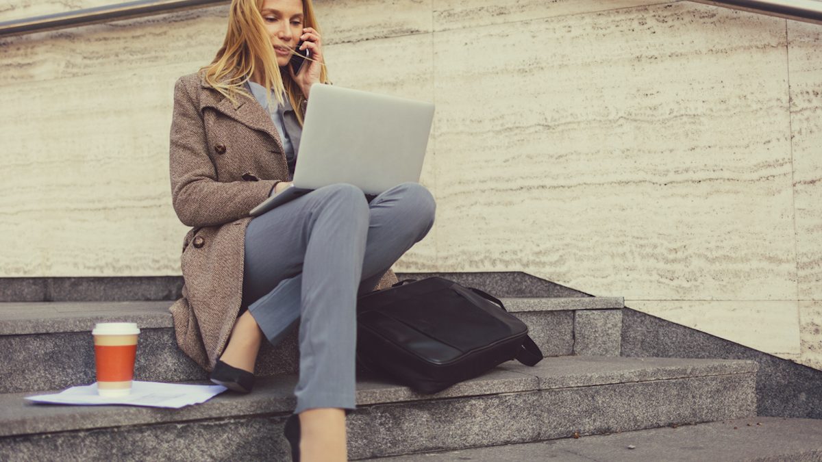 Businesswoman working outdoors