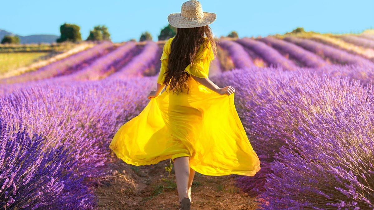 Woman running on lavender field