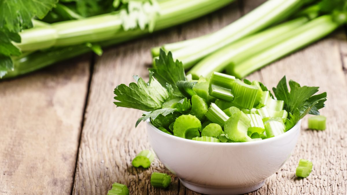 Fresh sliced celery in a white bowl