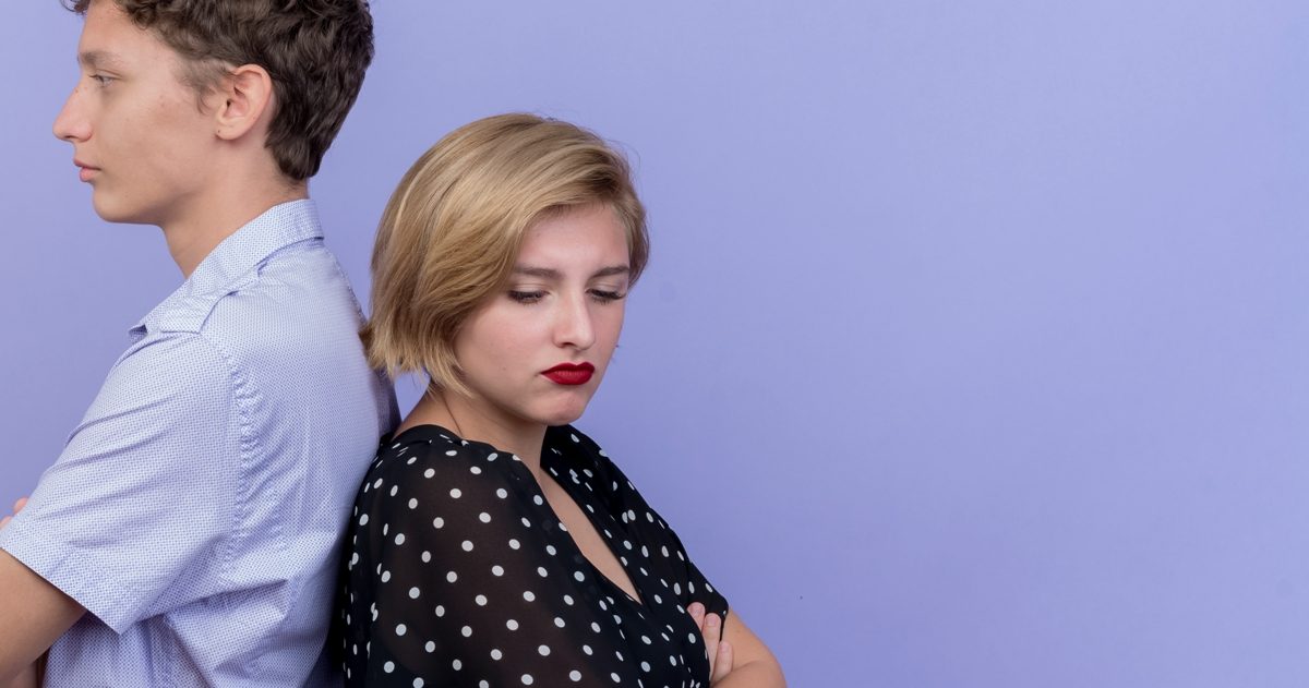 young-beautiful-couple-man-woman-standing-back-back-frowning-standing-blue-wall